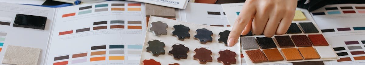 pexels-photo-6648439-6648439 Designers reviewing color swatches and sketches for project planning.